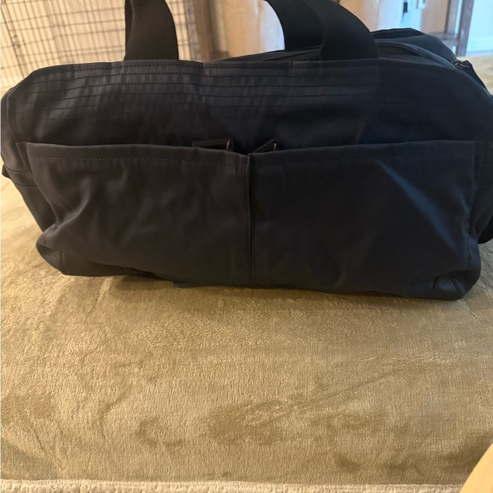 Blue Duffel Bag with Textured Fabric and Multiple Compartments